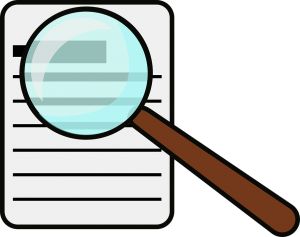 Image contains a graphic piece of paper and magnifying glass.